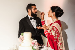 Indian bride giving cake to the groom. Indian bride giving cake to the groom.