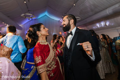 Adorable indian couple showing some dance moves. Adorable indian couple showing some dance moves.
