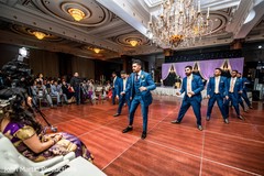 Indian groom and groomsmen performing a dance for indian bride. Indian groom and groomsmen performing a dance for indian bride.