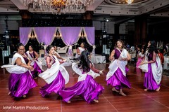 Indian bridesmaids dancing on their white and purple saree. Indian bridesmaids dancing on their white and purple saree.