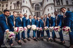 Indian groomsmen holding bridesmaids bouquet. Indian groomsmen holding bridesmaids bouquet.