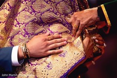 Indian bride being covered with purple and golden veil. Indian bride being covered with purple and golden veil.