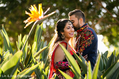 Indian groom whispering into her Maharani's ear Indian groom whispering into her Maharani's ear