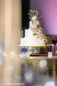 White and golden Indian wedding cake. White and golden Indian wedding cake.