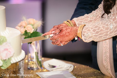 Indian bride cutting cake moment. Indian bride cutting cake moment.
