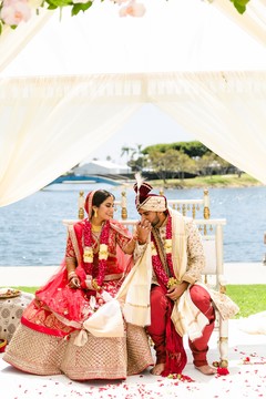 Indian groom kissing his Maharani's hand. Indian groom kissing his Maharani's hand.