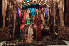 Indian couple on wooden swing seat. Indian couple on wooden swing seat.