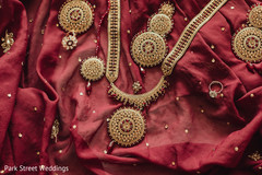 Indian bridal yellow gold and red stones on kundan set. Indian bridal yellow gold and red stones on kundan set.