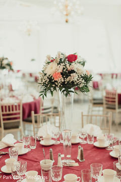 Indian wedding table tall centerpiece flowers decoration. Indian wedding table tall centerpiece flowers decoration.