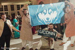 Indian groomsmen showing a University sign. Indian groomsmen showing a University sign.