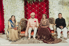 Indian couple with relatives at ceremony stage. Indian couple with relatives at ceremony stage.