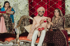 Indian groom showing his wedding ring capture. Indian groom showing his wedding ring capture.