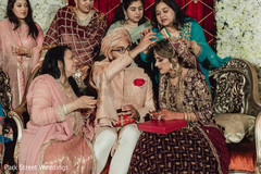 Indian groom putting red mark on maharani's forehead. Indian groom putting red mark on maharani's forehead.