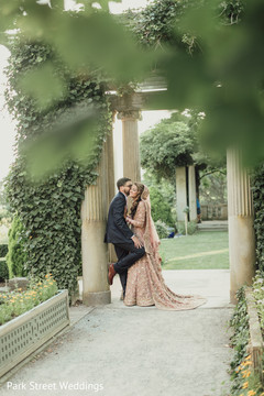 Indian groom kissing bride. Indian groom kissing bride.