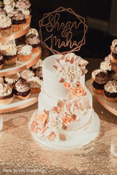 Cream and peach color Indian wedding cake decor. Cream and peach color Indian wedding cake decor.