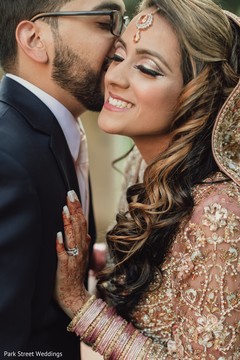 Indian groom giving a kiss to bride capture. Indian groom giving a kiss to bride capture.