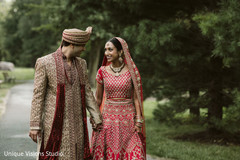 Indian couple walking together while holding hands. Indian couple walking together while holding hands.