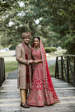 Indian couple holding hands on the bridge. Indian couple holding hands on the bridge.