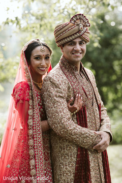 Indian couple with wedding clothes looking at the camera. Indian couple with wedding clothes looking at the camera.