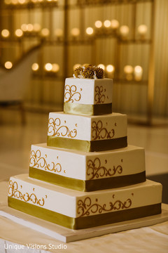 Wedding cake decorated with golden details. Wedding cake decorated with golden details.