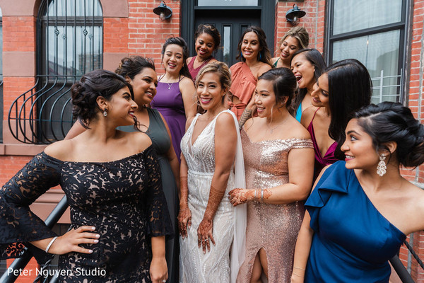Indian bride surrounded by her female Indian relatives