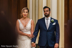 Indian bride and Indian groom holding hands during the ceremony Indian bride and Indian groom holding hands during the ceremony