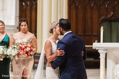 Indian couple kissing after the ceremony Indian couple kissing after the ceremony