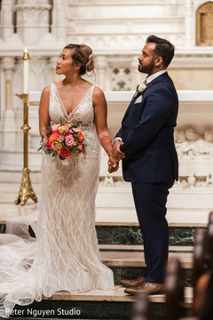 Indian newlyweds standing together in the church Indian newlyweds standing together in the church