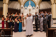 Priest and Indian relatives blessing the Indian couple Priest and Indian relatives blessing the Indian couple
