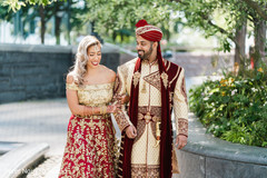 Maharani clinging to her Indian groom's arm while walking Maharani clinging to her Indian groom's arm while walking
