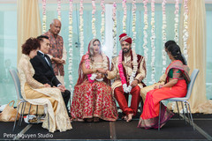 Indian couple holding hands on the wedding stage Indian couple holding hands on the wedding stage