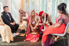 Indian couple pouring an offering Indian couple pouring an offering