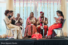 Indian couple and Indian relatives saying a prayer Indian couple and Indian relatives saying a prayer