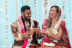 Indian couple exchanging rings Indian couple exchanging rings