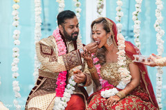 Indian couple sharing their first meal Indian couple sharing their first meal