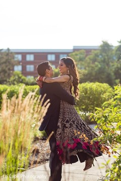 Indian groom lifting bride up. Indian groom lifting bride up.