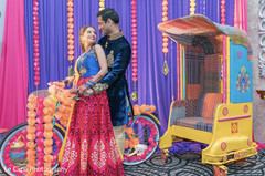 India bride and groom possing next to indian bike. India bride and groom possing next to indian bike.