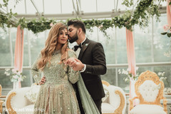 Indoor indian groom kissing bridal Indoor indian groom kissing bridal