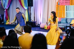 Indian couple dance performance at sangeet party. Indian couple dance performance at sangeet party.