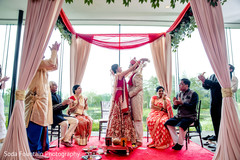 Indian bride and groom exchanging garlands ceremony. Indian bride and groom exchanging garlands ceremony.