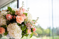 Indian wedding peach and white table flowers decorations. Indian wedding peach and white table flowers decorations.