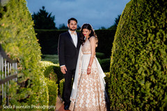 Indian couple on their gorgeous wedding reception outfits. Indian couple on their gorgeous wedding reception outfits.