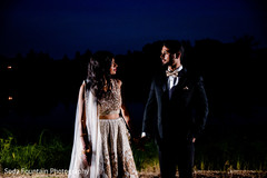 Indian couple posing for reception photo session. Indian couple posing for reception photo session.