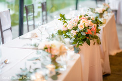 Indian wedding reception peach color table roses decor. Indian wedding reception peach color table roses decor.