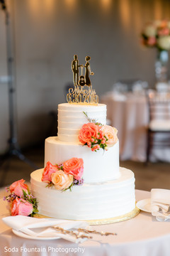Indian wedding white cake with roses decorations. Indian wedding white cake with roses decorations.