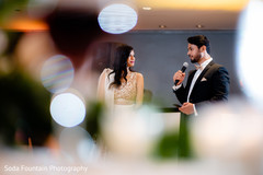 Indian groom giving out his speech at wedding reception . Indian groom giving out his speech at wedding reception .