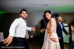 Cheerful indian wedding reception dance capture. Cheerful indian wedding reception dance capture.
