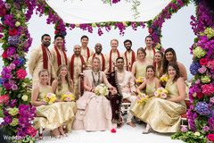 Sweet Indian couple with groomsmen and bridesmaids posing at mandap. Sweet Indian couple with groomsmen and bridesmaids posing at mandap.