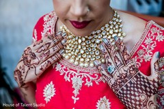 A close up to Maharani's choker and mehndi A close up to Maharani's choker and mehndi