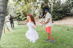 Indian groom hitting a bridal pinata. Indian groom hitting a bridal pinata.